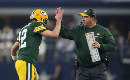 Jan 15, 2017; Arlington, TX, USA; Green Bay Packers quarterback Aaron Rodgers (12) celebrates a touchdown with head coach Mike McCarthy against the Dallas Cowboys in the NFC Divisional playoff game at AT&T Stadium. Mandatory Credit: Matthew Emmons-USA TODAY Sports