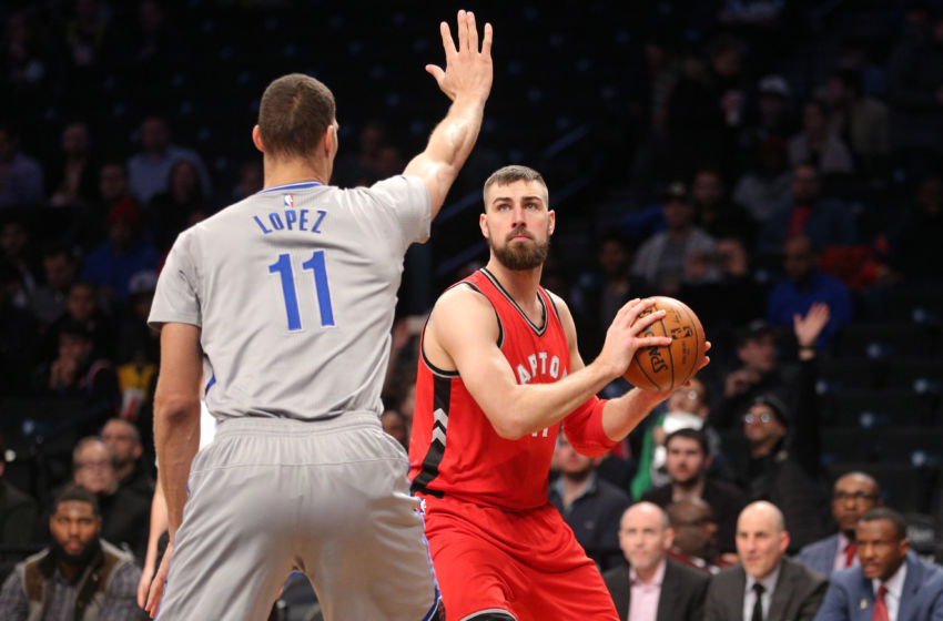 Jan 17, 2017; Brooklyn, NY, USA; Toronto Raptors center Jonas Valanciunas (17) controls the ball against Brooklyn Nets center Brook Lopez (11) during the first quarter at Barclays Center. Mandatory Credit: Brad Penner-USA TODAY Sports