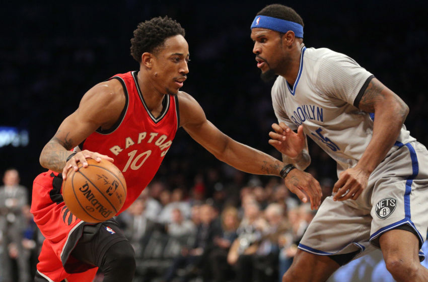 Jan 17, 2017; Brooklyn, NY, USA; Toronto Raptors shooting guard DeMar DeRozan (10) drives against Brooklyn Nets power forward Trevor Booker (35) during the second quarter at Barclays Center. Mandatory Credit: Brad Penner-USA TODAY Sports
