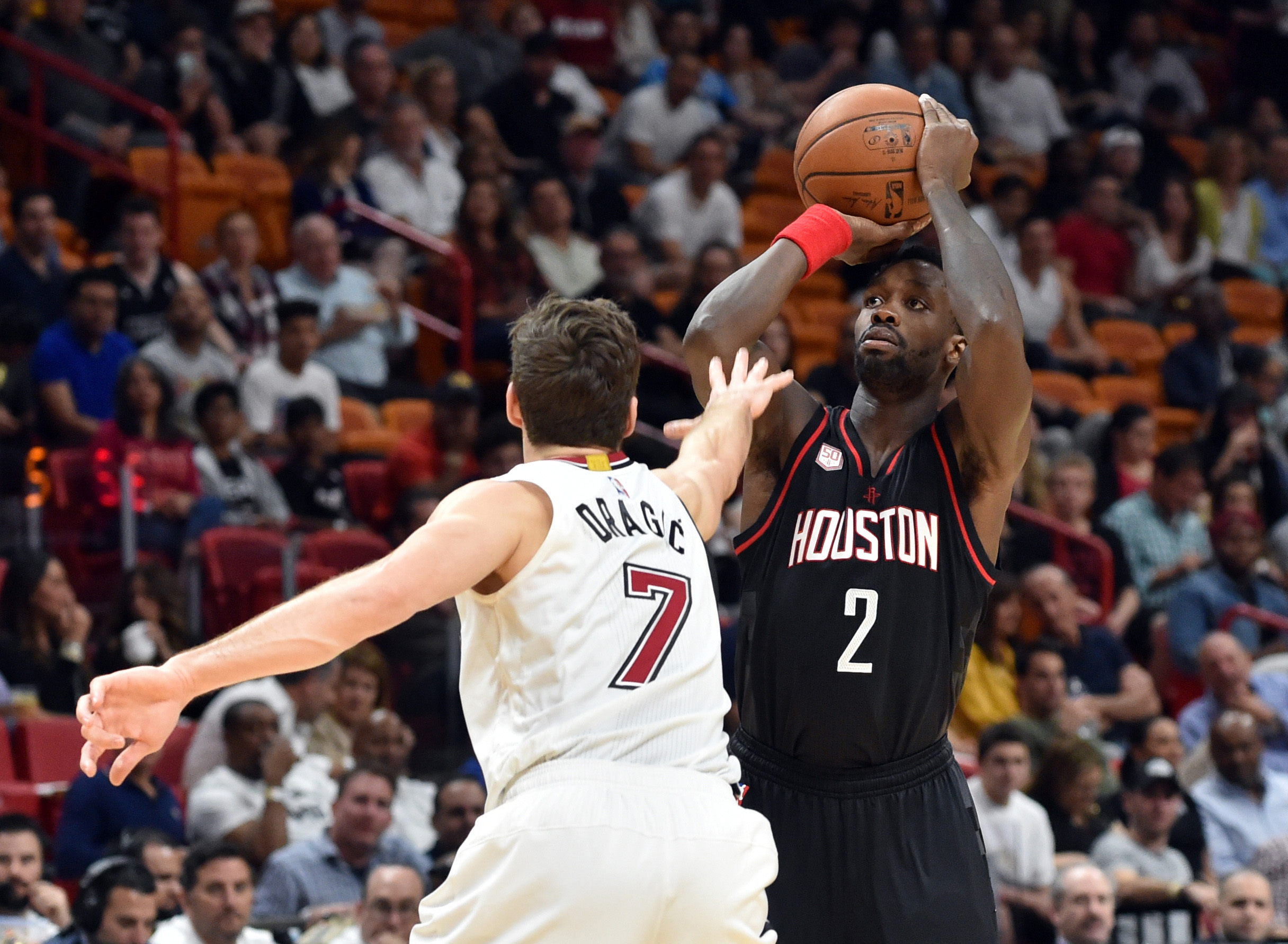 Jan 17, 2017; Miami, FL, USA; Houston Rockets guard Patrick Beverley (2) prepares to shoot the ball as Miami Heat guard Goran Dragic (7) defends during the first half at American Airlines Arena. Mandatory Credit: Steve Mitchell-USA TODAY Sports