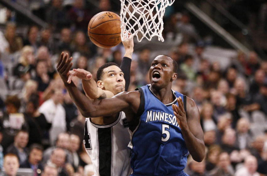 Jan 17, 2017; San Antonio, TX, USA; San Antonio Spurs shooting guard Danny Green (14, behind) blocks a shot attempt by Minnesota Timberwolves power forward Gorgui Dieng (5) during the second half at AT&T Center. Mandatory Credit: Soobum Im-USA TODAY Sports