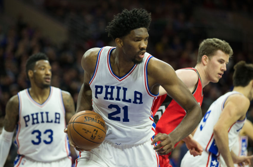 Jan 18, 2017; Philadelphia, PA, USA; Philadelphia 76ers center Joel Embiid (21) rebounds the ball against the Toronto Raptors during the third quarter at Wells Fargo Center. The Philadelphia 76ers won 94-89. Mandatory Credit: Bill Streicher-USA TODAY Sports