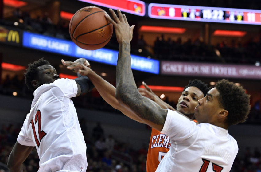 Jan 19, 2017; Louisville, KY, USA; Louisville Cardinals forward Ray Spalding (13) blocks the shot of Clemson Tigers forward Jaron Blossomgame (5) during the first half at KFC Yum! Center. Mandatory Credit: Jamie Rhodes-USA TODAY Sports