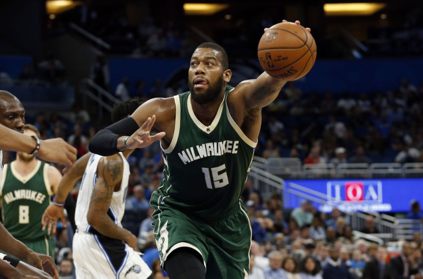 Jan 20, 2017; Orlando, FL, USA; Milwaukee Bucks center Greg Monroe (15) grabs the ball against the Orlando Magic during the first half at Amway Center. Mandatory Credit: Kim Klement-USA TODAY Sports