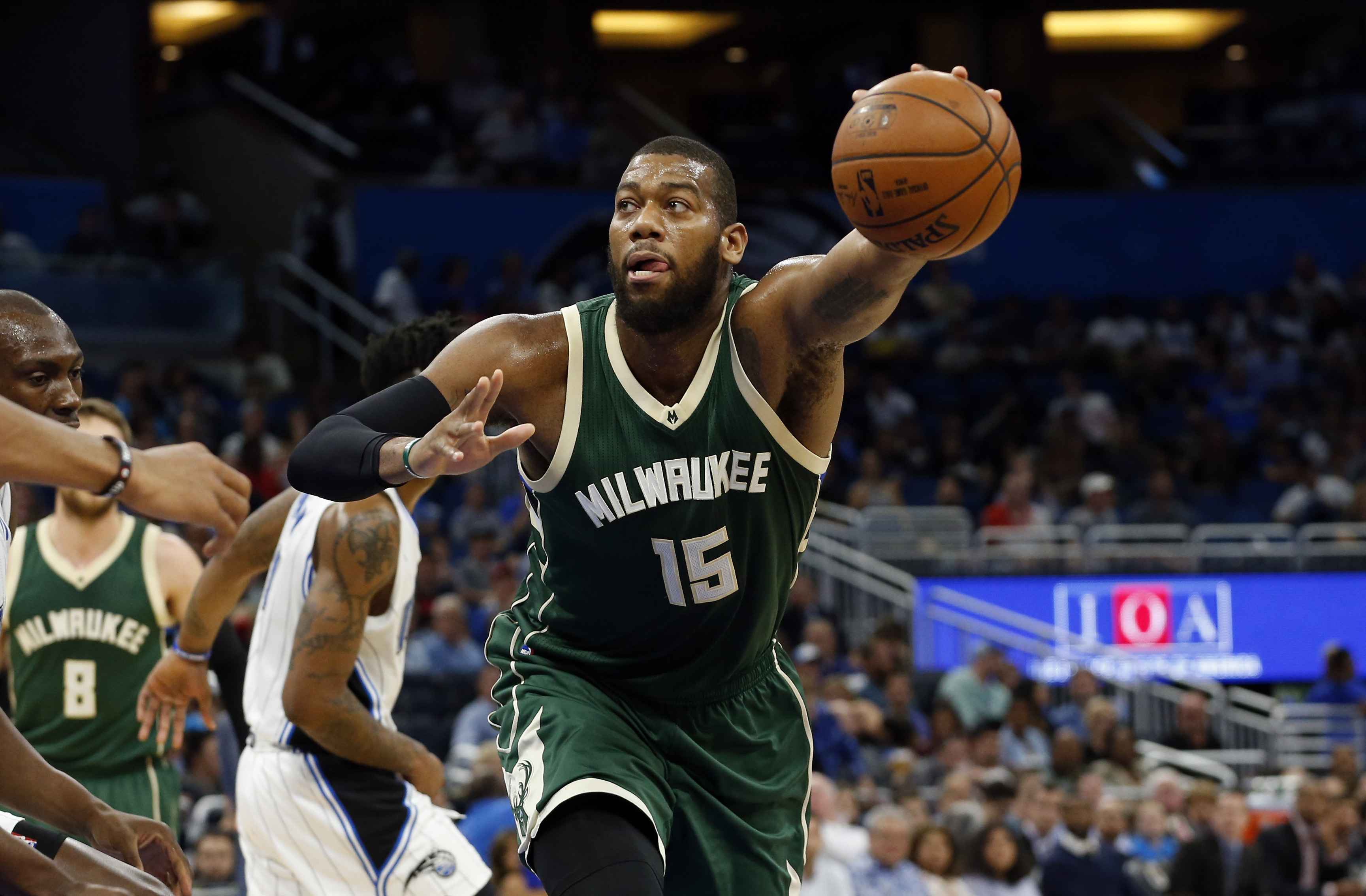 Jan 20, 2017; Orlando, FL, USA; Milwaukee Bucks center Greg Monroe (15) grabs the ball against the Orlando Magic during the first half at Amway Center. Mandatory Credit: Kim Klement-USA TODAY Sports
