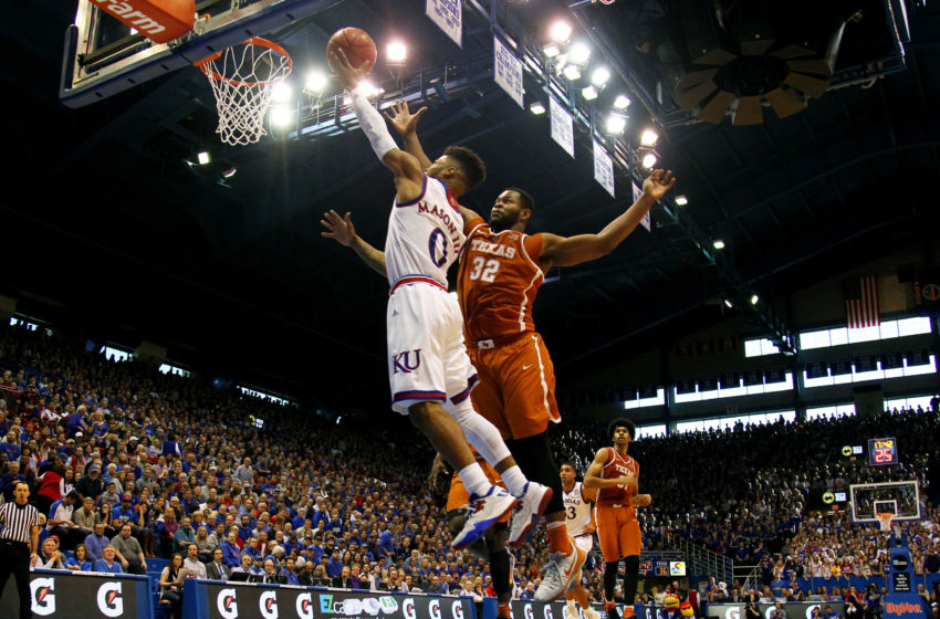 Jan 21, 2017; Lawrence, KS, USA; Kansas Jayhawks guard Frank Mason (0) shoots a lay up as Texas Longhorns forward Shaquille Cleare (32) defends during the second half at Allen Fieldhouse. The Jayhawks won 79-67. Mandatory Credit: Jay Biggerstaff-USA TODAY Sports