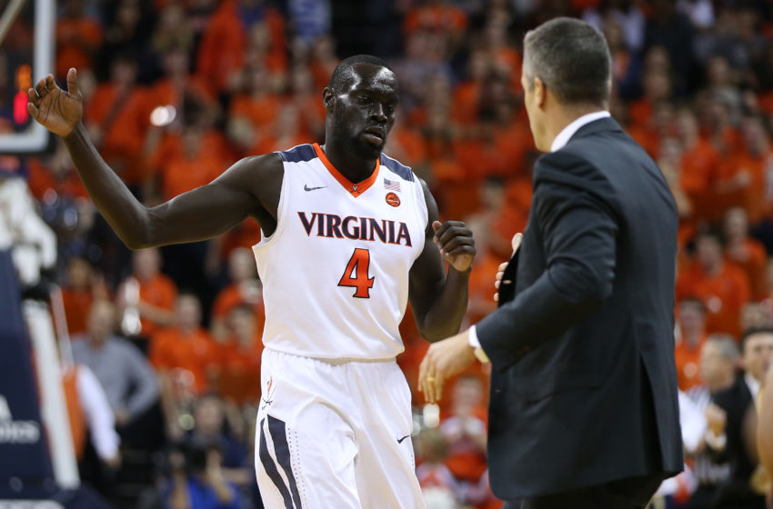 Jan 21, 2017; Charlottesville, VA, USA; Virginia Cavaliers guard Marial Shayok (4) celebrates with head coach Tony Bennett (R) after scoring against the Georgia Tech Yellow Jackets during the first half at John Paul Jones Arena. The Cavaliers won 62-49. Mandatory Credit: Amber Searls-USA TODAY Sports