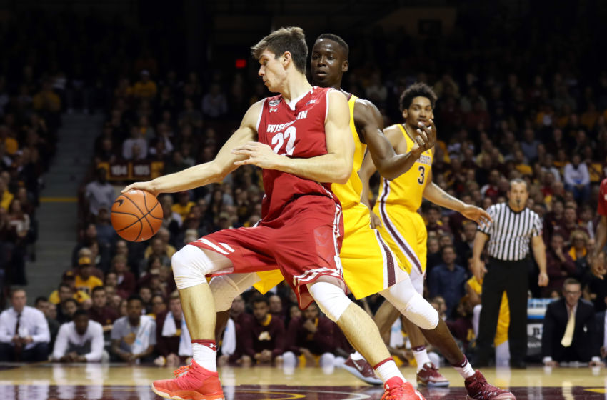 Jan 21, 2017; Minneapolis, MN, USA; Wisconsin Badgers forward Ethan Happ (22) drives to the basket against Minnesota Golden Gophers center Bakary Konate (21) during the first half at Williams Arena. Mandatory Credit: Jordan Johnson-USA TODAY Sports
