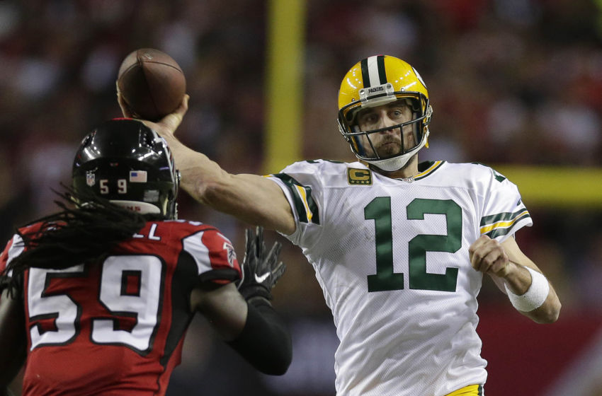 Jan 22, 2017; Atlanta, GA, USA; Green Bay Packers quarterback Aaron Rodgers (12) throws against Atlanta Falcons outside linebacker De'Vondre Campbell (59) during the fourth quarter in the 2017 NFC Championship Game at the Georgia Dome. Mandatory Credit: Rick Wood/Milwaukee Journal Sentinel via USA TODAY NETWORK