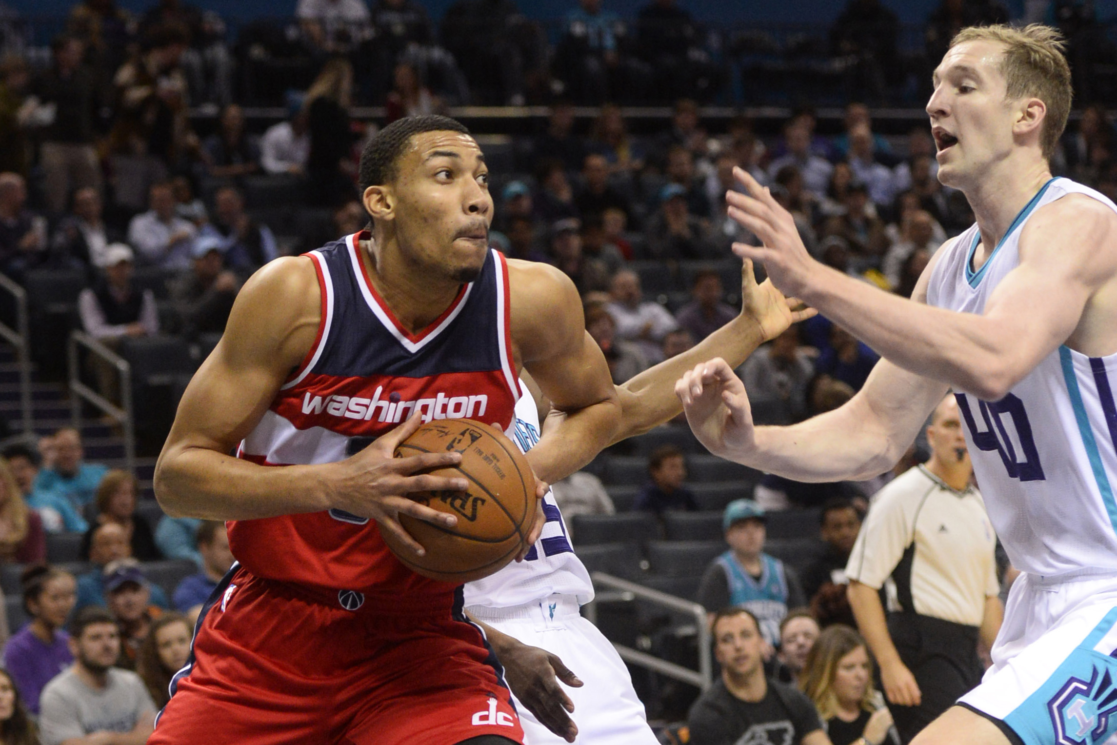 Jan 23, 2017; Charlotte, NC, USA; Washington Wizards forward Otto Porter (22) looks to shoot as he is defended by Charlotte Hornets forward center Cody Zeller (40) during the first half of the game at the Spectrum Center. Mandatory Credit: Sam Sharpe-USA TODAY Sports