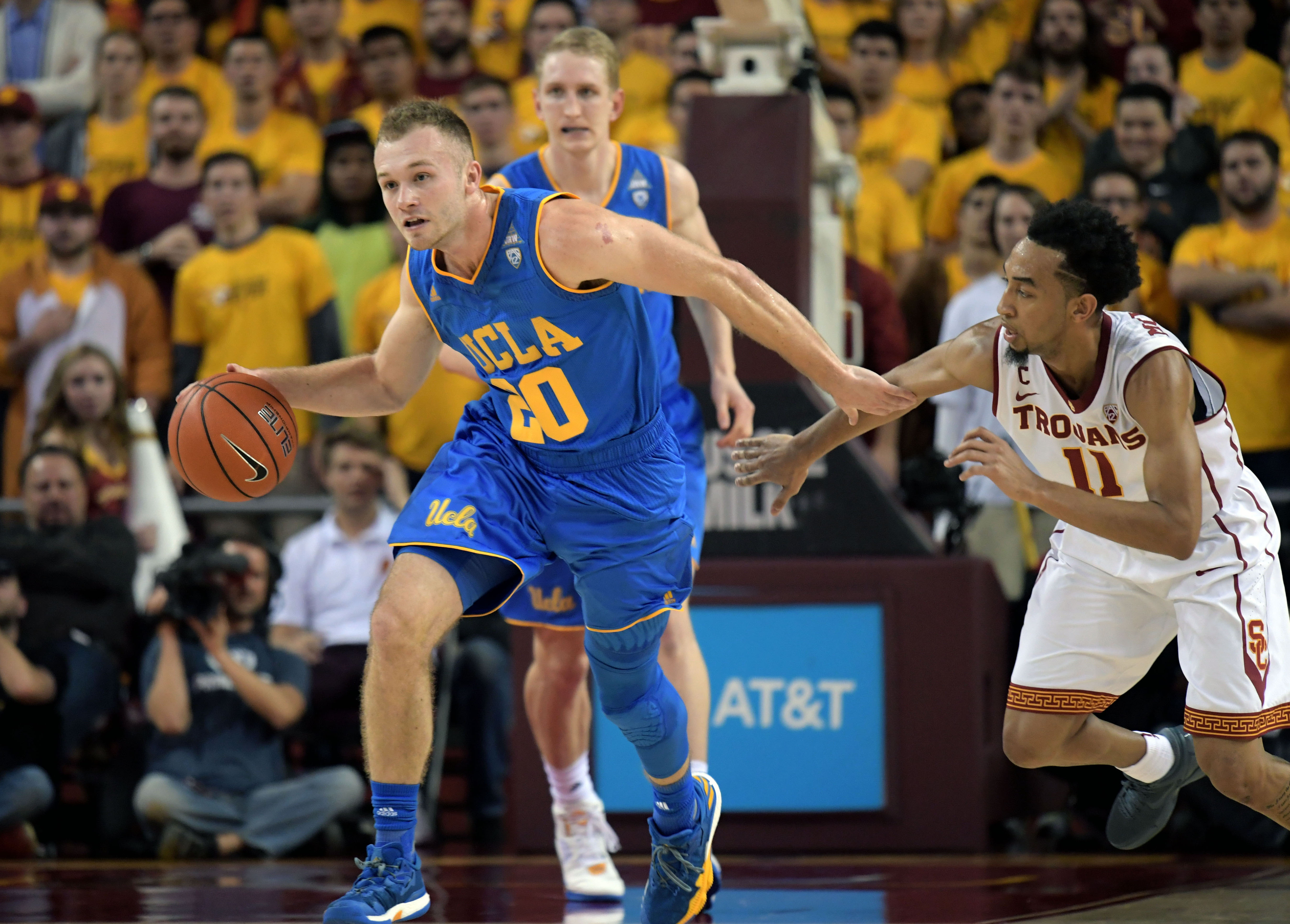 Jan 25, 2017; Los Angeles, CA, USA; UCLA Bruins guard Bryce Alford (20) controls the ball against Southern California Trojans guard Jordan McLaughlin (11) during the first half at Galen Center. Mandatory Credit: Kirby Lee-USA TODAY Sports