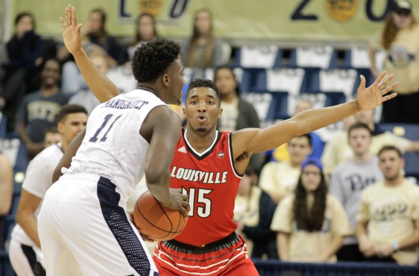 Jan 24, 2017; Pittsburgh, PA, USA; Louisville Cardinals guard Donovan Mitchell (45) defends Pittsburgh Panthers forward Corey Manigault (11) during the second half at the Petersen Events Center. Louisville won 106-51. Mandatory Credit: Charles LeClaire-USA TODAY Sports