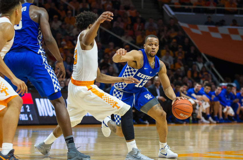 Jan 24, 2017; Knoxville, TN, USA; Kentucky Wildcats guard Isaiah Briscoe (13) drives around Tennessee Volunteers guard Robert Hubbs III (3) during the first half at Thompson-Boling Arena. Tennessee defeated Kentucky 82-80. Mandatory Credit: Bryan Lynn-USA TODAY Sports