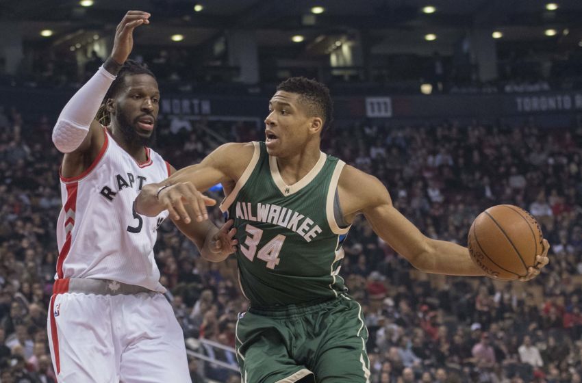 Jan 27, 2017; Toronto, Ontario, CAN; Milwaukee Bucks forward Giannis Antetokounmpo (34) controls a ball against Toronto Raptors forward DeMarre Carroll (5) during the first quarter in a game at Air Canada Centre. Mandatory Credit: Nick Turchiaro-USA TODAY Sports