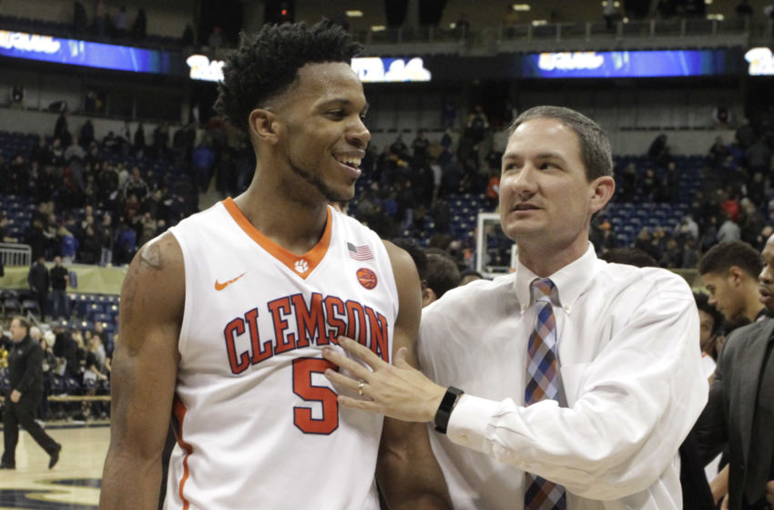 Jan 28, 2017; Pittsburgh, PA, USA; Clemson Tigers forward Jaron Blossomgame (5) and assistant coach Nick Bowman (right) celebrate after defeating the Pittsburgh Panthers at the Petersen Events Center. Clemson won 67-60. Mandatory Credit: Charles LeClaire-USA TODAY Sports
