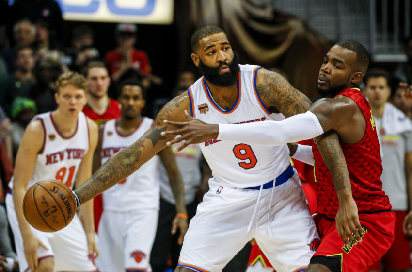 Jan 29, 2017; Atlanta, GA, USA; New York Knicks center Kyle O'Quinn (9) tries to keep the ball away from Atlanta Hawks forward Paul Millsap (4) during the second overtime at Philips Arena. Mandatory Credit: Butch Dill-USA TODAY Sports