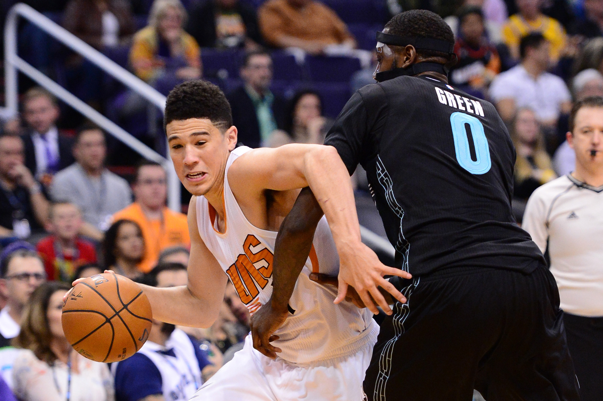 Jan 30, 2017; Phoenix, AZ, USA; Phoenix Suns guard Devin Booker (1) handles the ball against Memphis Grizzlies forward JaMychal Green (0) in the second half of the NBA game at Talking Stick Resort Arena. The Memphis Grizzlies won 115-96. Mandatory Credit: Jennifer Stewart-USA TODAY Sports