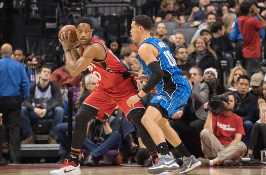 Jan 29, 2017; Toronto, Ontario, CAN; Toronto Raptors guard DeMar DeRozan (10) controls a ball as Orlando Magic forward Aaron Gordon (00) tries to defend during the second quarter in a game at Air Canada Centre. The Orlando Magic won 114-113. Mandatory Credit: Nick Turchiaro-USA TODAY Sports
