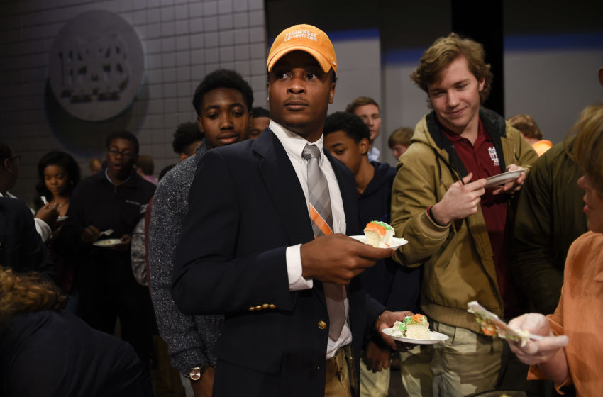 Feb 1, 2017; Nashville, TN, USA; Montgomery Bell Academy football player Ty Chandler hands out cake to his classmates after signing his letter of intent to attend the University of Tennessee at a ceremony during National Signing Day. Mandatory Credit: George Walker IV / The Tennessean via USA TODAY NETWORK