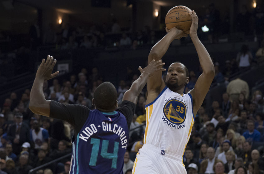 February 1, 2017; Oakland, CA, USA; Golden State Warriors forward Kevin Durant (35) shoots the basketball against Charlotte Hornets forward Michael Kidd-Gilchrist (14) during the fourth quarter at Oracle Arena. The Warriors defeated the Hornets 126-111. Mandatory Credit: Kyle Terada-USA TODAY Sports