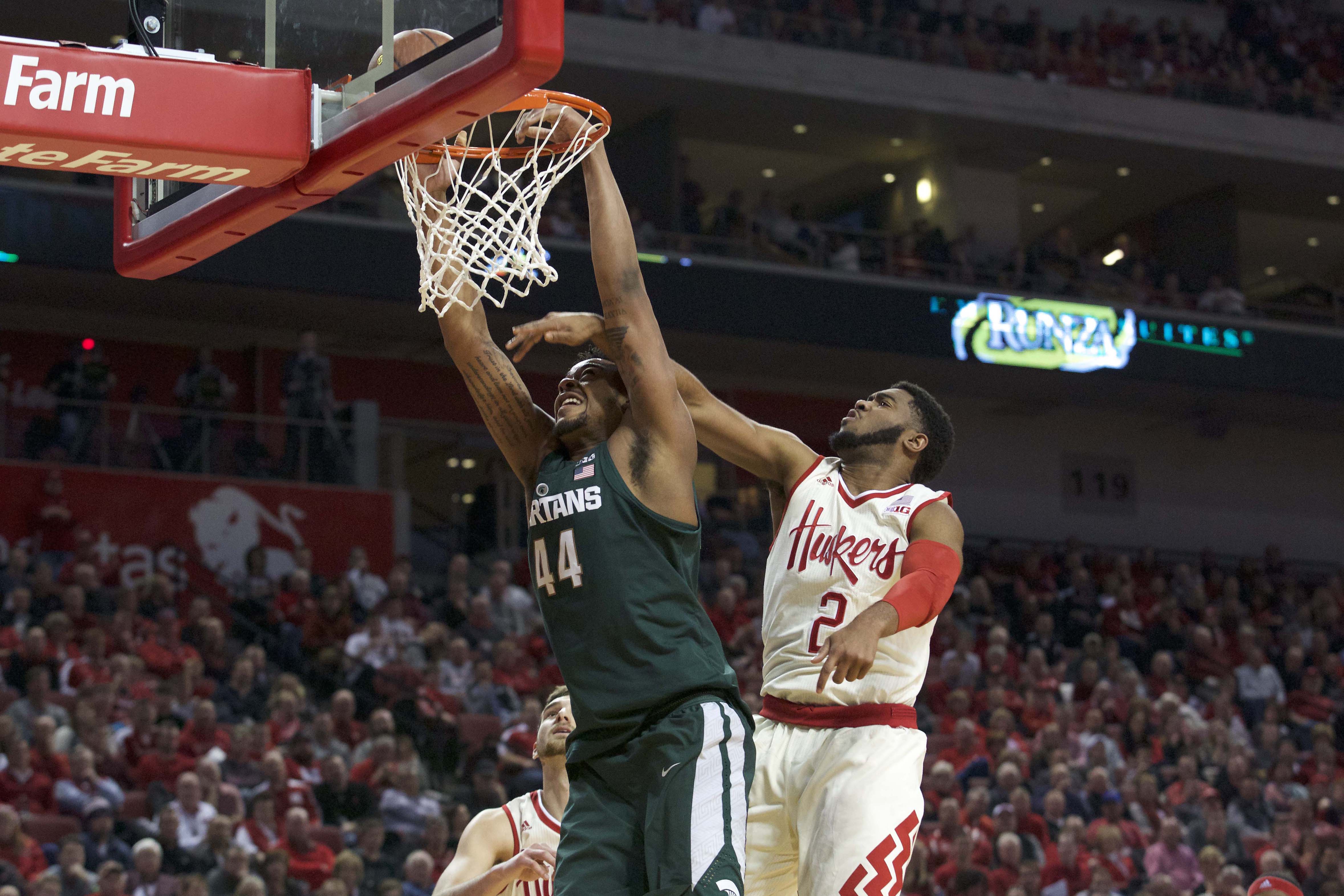 Feb 2, 2017; Lincoln, NE, USA; Michigan State Spartans forward Nick Ward (44) dunks against Nebraska Cornhuskers center Jordy Tshimanga (32) in the second half at Pinnacle Bank Arena. Michigan State won 72-61. Mandatory Credit: Bruce Thorson-USA TODAY Sports