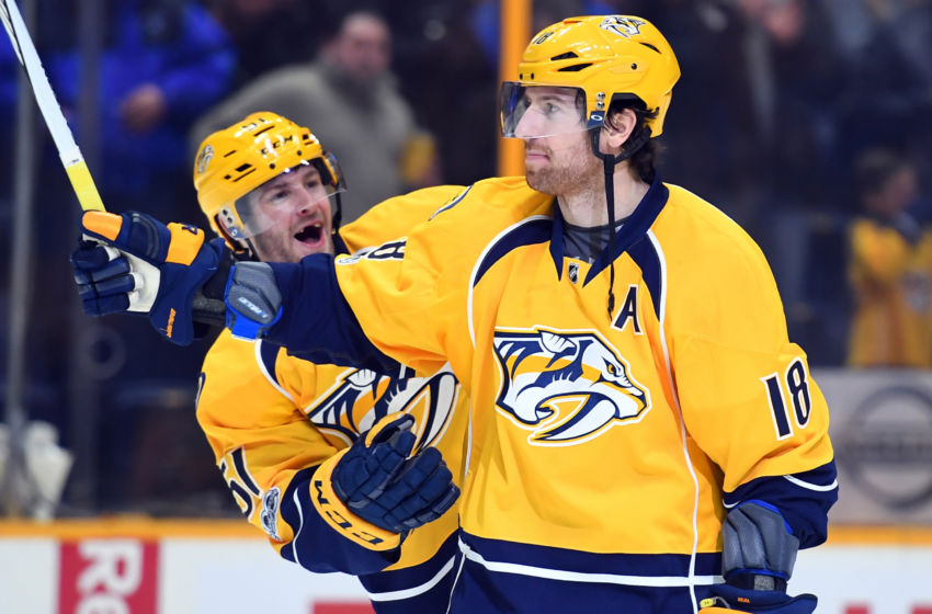 Feb 2, 2017; Nashville, TN, USA; Nashville Predators left wing Austin Watson (51) and right wing James Neal (18) celebrate after their game against the Edmonton Oilers at Bridgestone Arena. The Predators won 2-0. Mandatory Credit: Christopher Hanewinckel-USA TODAY Sports