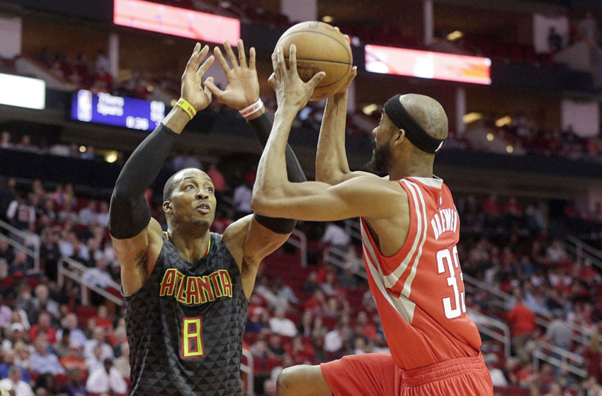 Feb 2, 2017; Houston, TX, USA; Houston Rockets forward Corey Brewer (33) drives against Atlanta Hawks center Dwight Howard (8) in the second half at Toyota Center. Atlanta Hawks won 113 to 108. Mandatory Credit: Thomas B. Shea-USA TODAY Sports