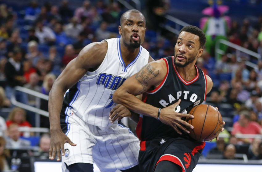 Feb 3, 2017; Orlando, FL, USA; Toronto Raptors guard Norman Powell (24) dribbles the ball past Orlando Magic forward Serge Ibaka (7) during the second quarter of an NBA basketball game at Amway Center. Mandatory Credit: Reinhold Matay-USA TODAY Sports