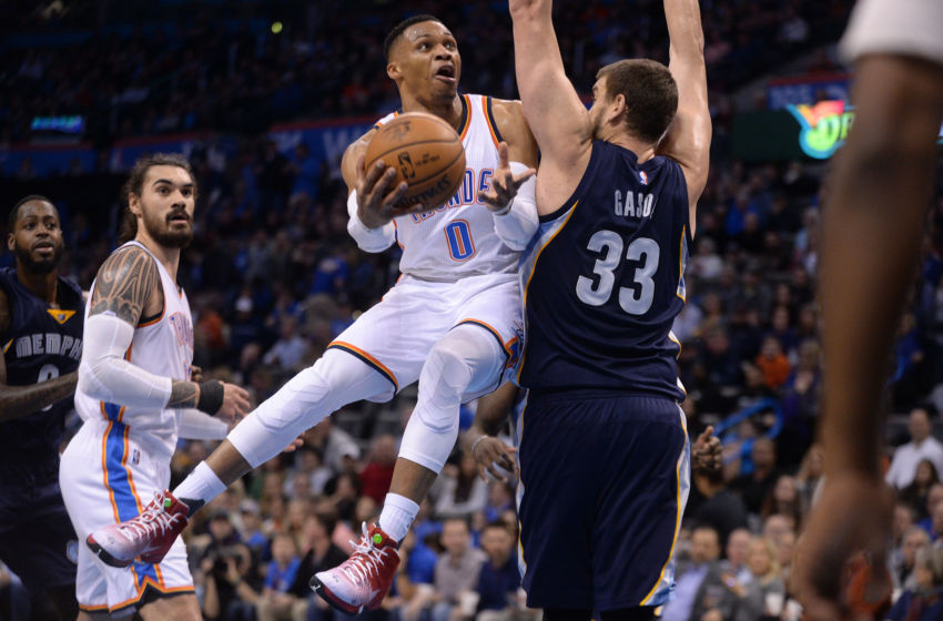 Feb 3, 2017; Oklahoma City, OK, USA; Oklahoma City Thunder guard Russell Westbrook (0) drives to the basket in front of Memphis Grizzlies center Marc Gasol (33) during the third quarter at Chesapeake Energy Arena. Mandatory Credit: Mark D. Smith-USA TODAY Sports