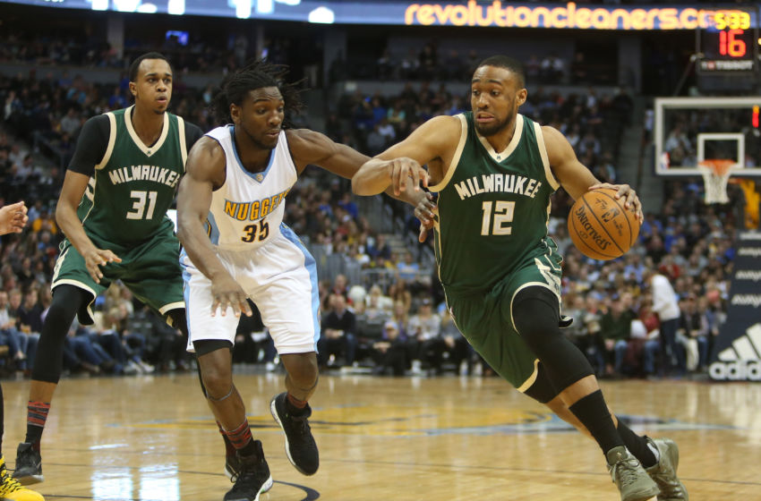 Feb 3, 2017; Denver, CO, USA; Milwaukee Bucks forward Jabari Parker (12) drives to the basket against Denver Nuggets forward Kenneth Faried (35) during the first half at Pepsi Center. Mandatory Credit: Chris Humphreys-USA TODAY Sports