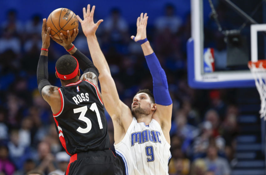 Feb 3, 2017; Orlando, FL, USA; Toronto Raptors forward Terrence Ross (31) shoots over Orlando Magic center Nikola Vucevic (9) during the second half of an NBA basketball game at Amway Center.The Magic won 102-94. Mandatory Credit: Reinhold Matay-USA TODAY Sports