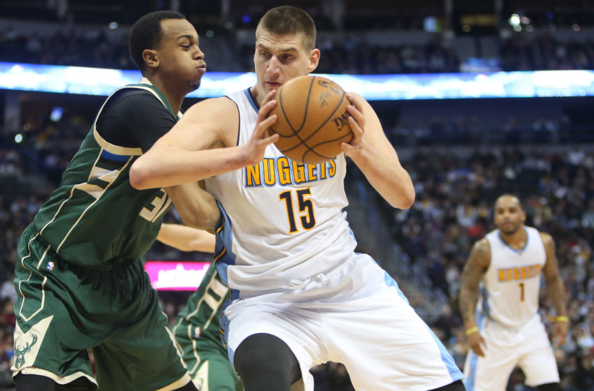 Feb 3, 2017; Denver, CO, USA; Denver Nuggets forward Nikola Jokic (15) drives to the basket against Milwaukee Bucks center John Henson (31) during the second half at Pepsi Center. The Nuggets won 121-117. Mandatory Credit: Chris Humphreys-USA TODAY Sports