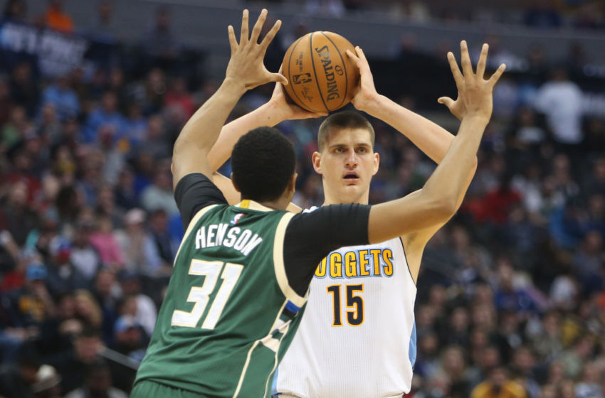 Feb 3, 2017; Denver, CO, USA; Denver Nuggets forward Nikola Jokic (15) looks to pass the ball against Milwaukee Bucks center John Henson (31) during the second half at Pepsi Center. The Nuggets won 121-117. Mandatory Credit: Chris Humphreys-USA TODAY Sports