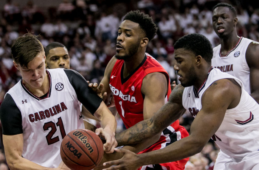 Feb 4, 2017; Columbia, SC, USA; South Carolina Gamecocks forward Maik Kotsar (21) and Georgia Bulldogs forward Yante Maten (1) and South Carolina Gamecocks guard Duane Notice (10) battle for a rebound in the first half at Colonial Life Arena. Mandatory Credit: Jeff Blake-USA TODAY Sports