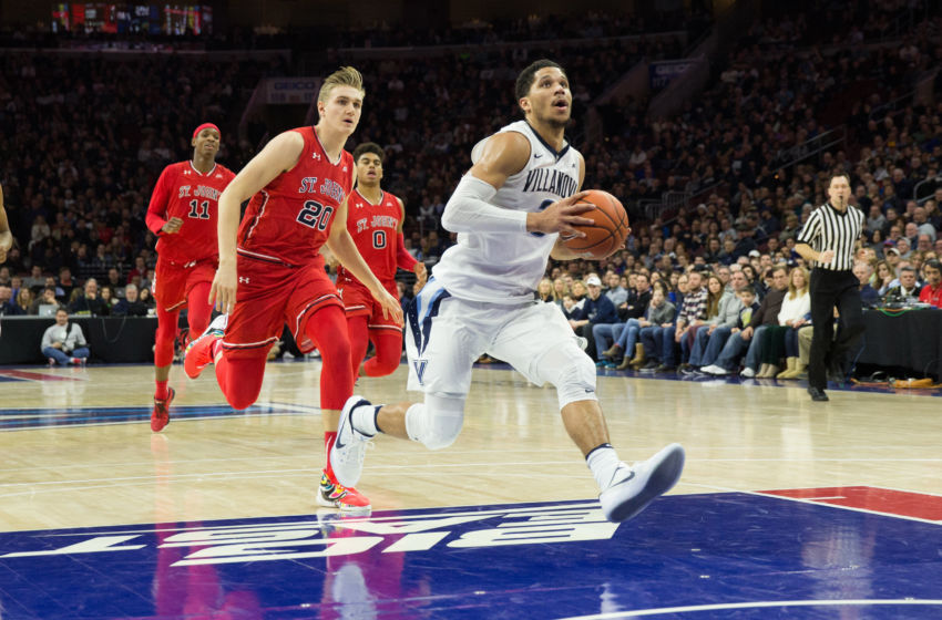 Feb 4, 2017; Philadelphia, PA, USA; Villanova Wildcats guard Josh Hart (3) runs past St. John's Red Storm forward Richard Freudenberg (20) for a score during the second half at Wells Fargo. The Villanova Wildcats won 92-79. Mandatory Credit: Bill Streicher-USA TODAY Sports