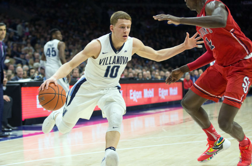Feb 4, 2017; Philadelphia, PA, USA; Villanova Wildcats guard Donte DiVincenzo (10) controls the ball against St. John's Red Storm forward Kassoum Yakwe (14) during the second half at Wells Fargo. The Villanova Wildcats won 92-79. Mandatory Credit: Bill Streicher-USA TODAY Sports