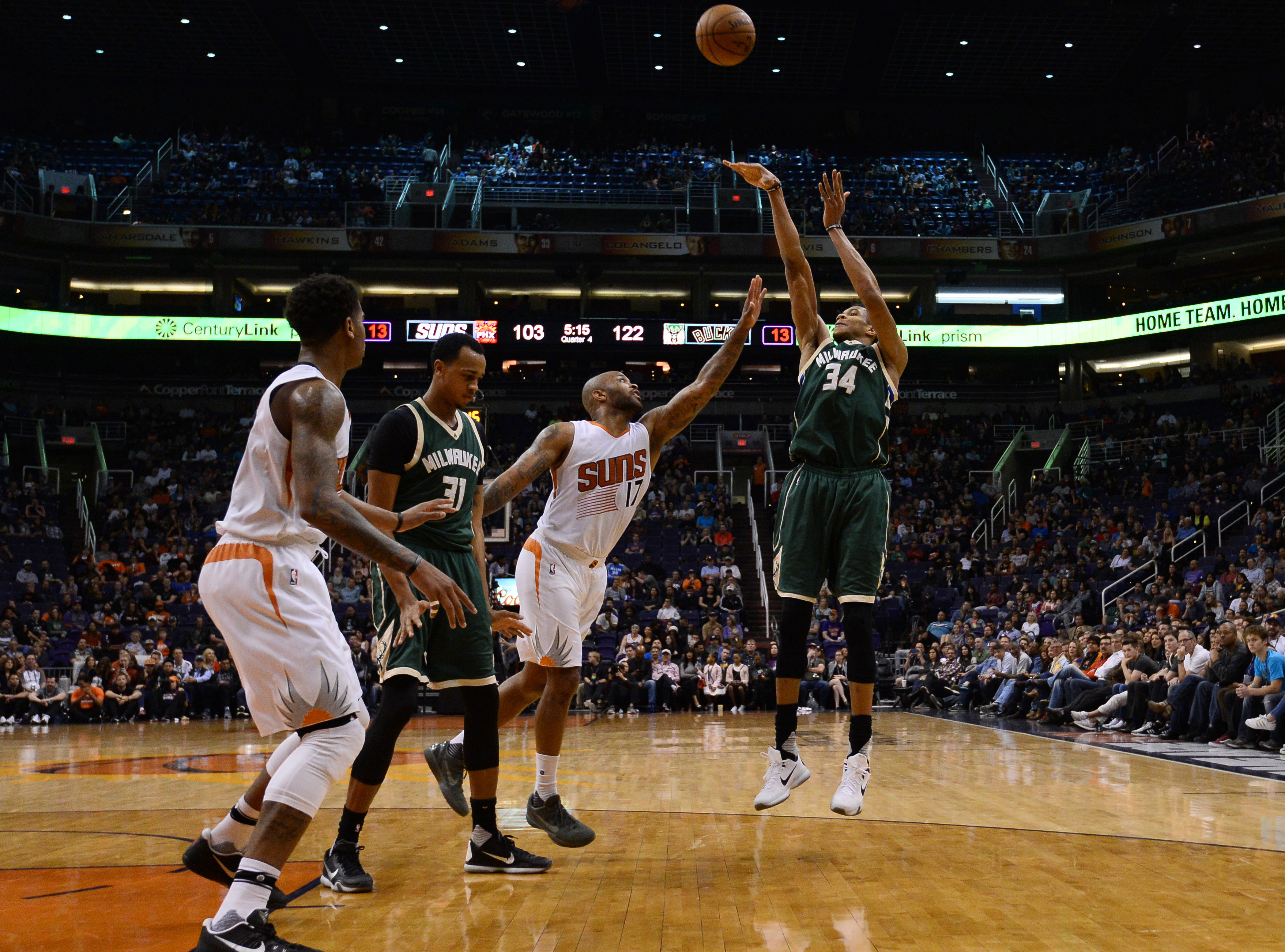 Feb 4, 2017; Phoenix, AZ, USA; Milwaukee Bucks forward Giannis Antetokounmpo (34) shoots over Phoenix Suns forward P.J. Tucker (17) during the second half at Talking Stick Resort Arena. The Bucks won 137-112. Mandatory Credit: Joe Camporeale-USA TODAY Sports