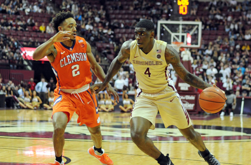 Feb 5, 2017; Tallahassee, FL, USA; Florida State Seminoles guard Dwayne Bacon (4) moves the ball around Clemson Tigers guard Marcquise Reed (2) during the second half at the Donald L. Tucker Center. Mandatory Credit: Melina Vastola-USA TODAY Sports
