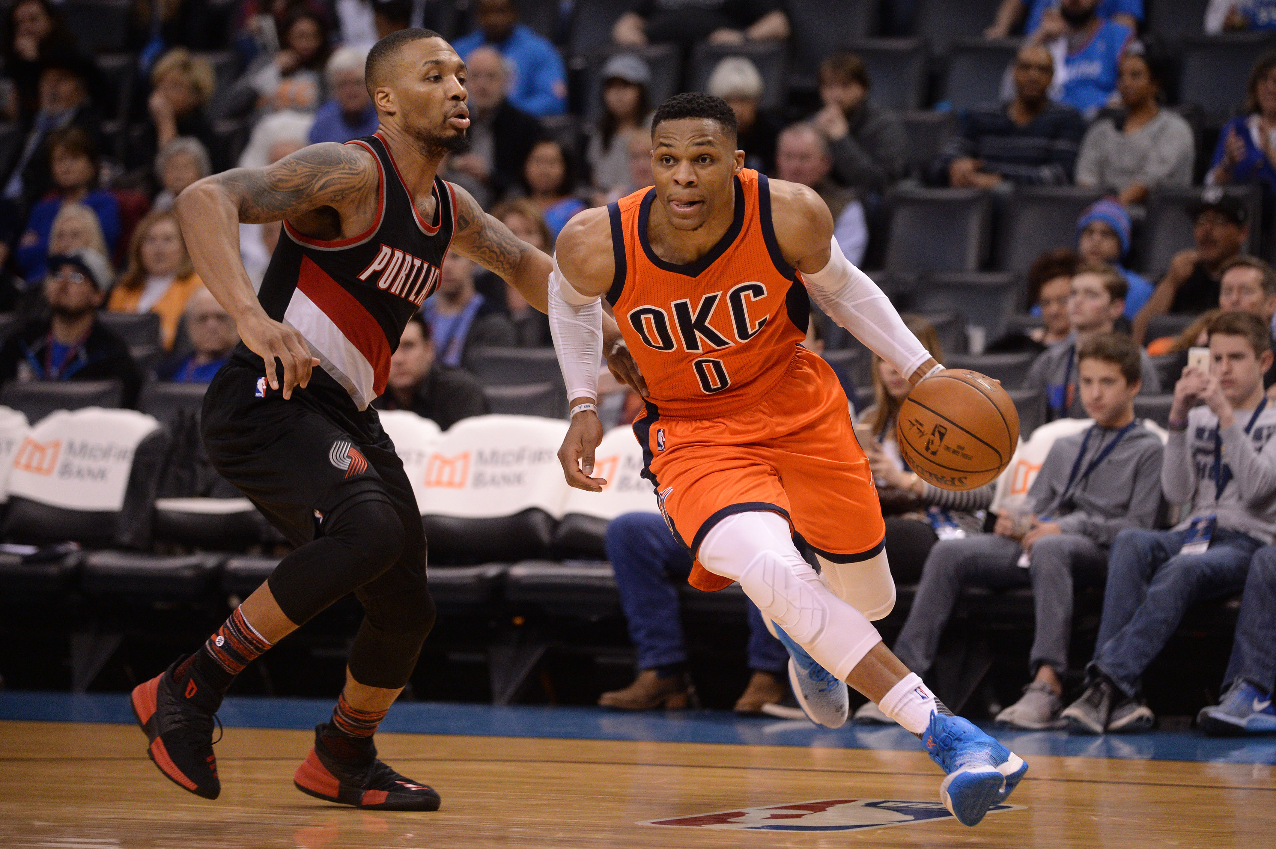 Feb 5, 2017; Oklahoma City, OK, USA; Oklahoma City Thunder guard Russell Westbrook (0) drives to the basket in front of Portland Trail Blazers guard Damian Lillard (0) during the third quarter at Chesapeake Energy Arena. Mandatory Credit: Mark D. Smith-USA TODAY Sports