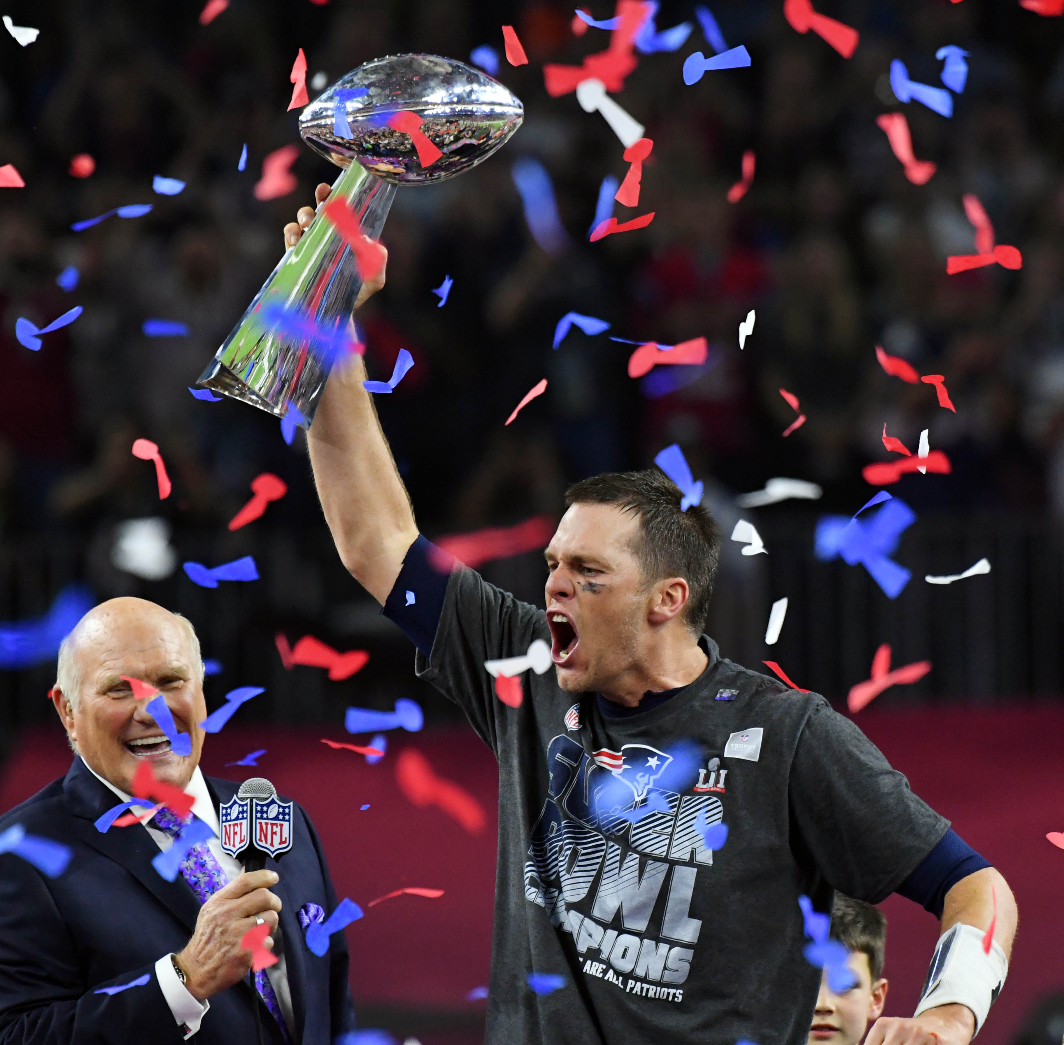 Feb 5, 2017; Houston, TX, USA; New England Patriots quarterback Tom Brady celebrates with the Vince Lombardi Trophy after defeating the Atlanta Falcons 34-38 in Super Bowl LI at NRG Stadium. Mandatory Credit: Robert Deutsch-USA TODAY Sports