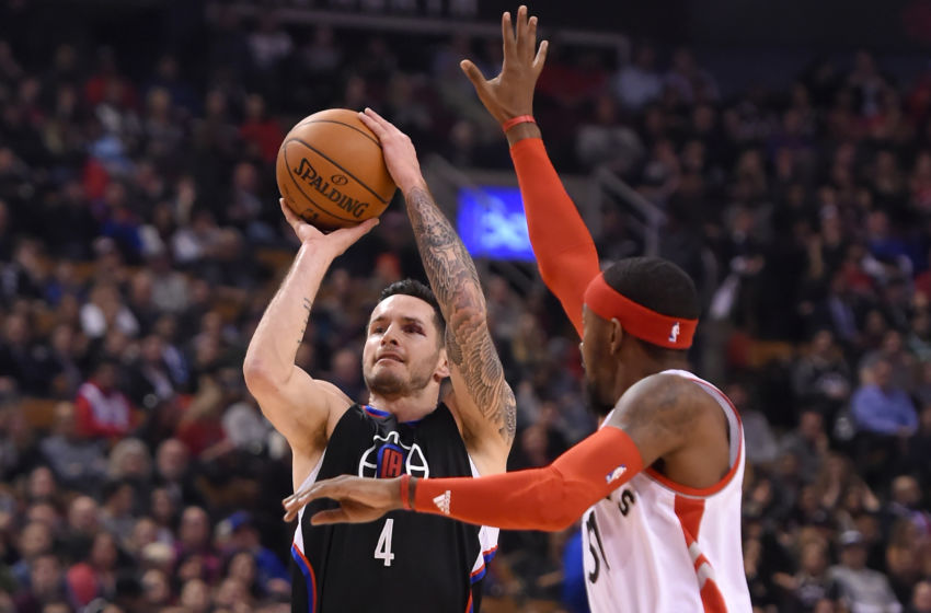 Feb 6, 2017; Toronto, Ontario, CAN; Los Angeles Clippers guard J.J. Redick (4) shoots the ball past Toronto Raptors guard Terrence Ross (31) in the first half at Air Canada Centre. The Raptors won 118-109. Mandatory Credit: Dan Hamilton-USA TODAY Sports