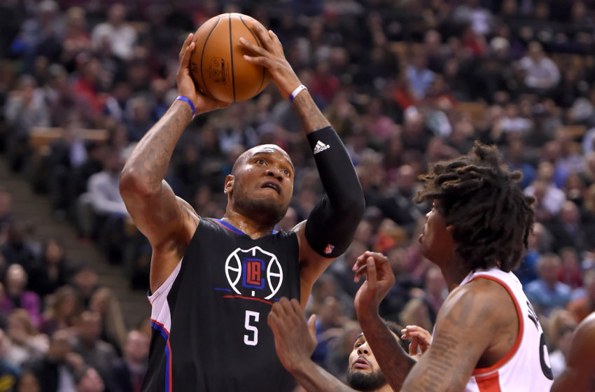 Feb 6, 2017; Toronto, Ontario, CAN; Los Angeles Clippers forward Marreese Speights (5) shoots for a basket past Toronto Raptors center Lucas Nogueira (92) in the second half at Air Canada Centre. Mandatory Credit: Dan Hamilton-USA TODAY Sports