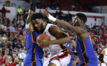 Feb 7, 2017; Athens, GA, USA; Georgia Bulldogs forward Yante Maten (1) controls the ball between Florida Gators forward Keith Stone (25) and forward Kevarrius Hayes (13) in the first half at Stegeman Coliseum. Jason Getz-USA TODAY Sports