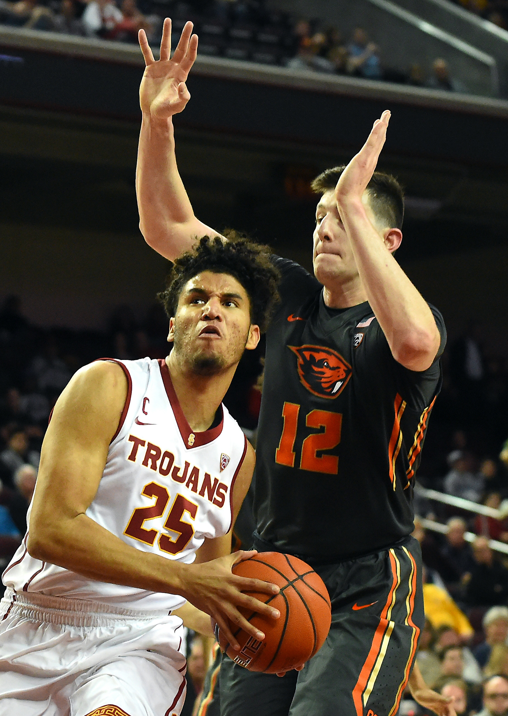 Feb 9, 2017; Los Angeles, CA, USA; Oregon State Beavers forward Drew Eubanks (12) guards USC Trojans forward Bennie Boatwright (25) as he drives to the basket in the first half of the game at Galen Center. Mandatory Credit: Jayne Kamin-Oncea-USA TODAY Sports