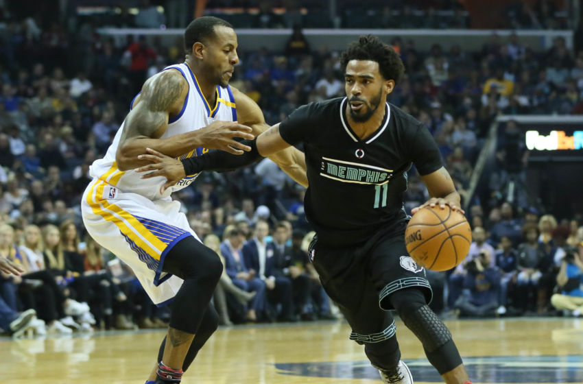 Feb 10, 2017; Memphis, TN, USA; Memphis Grizzlies guard Mike Conley (11) moves against Golden State Warriors guard Andre Iguodala (9) in the first half at FedExForum. Mandatory Credit: Nelson Chenault-USA TODAY Sports