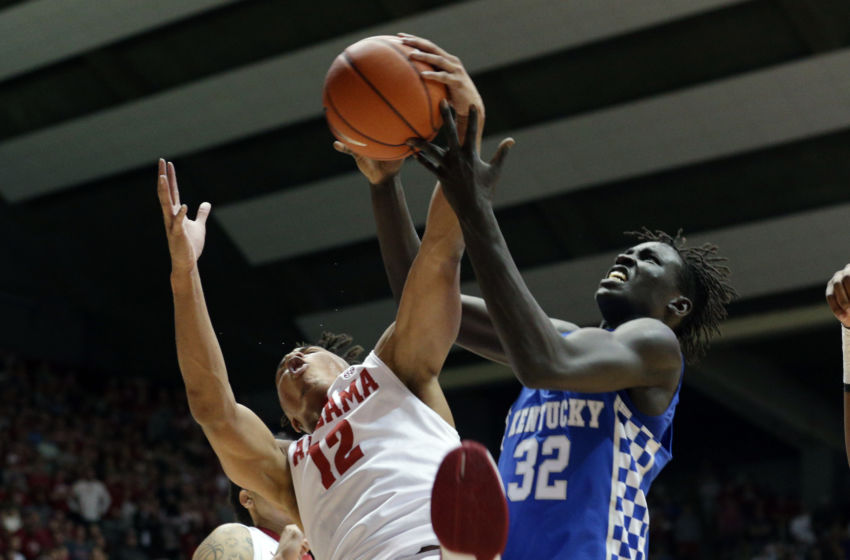 Feb 11, 2017; Tuscaloosa, AL, USA; Kentucky Wildcats forward Wenyen Gabriel (32) goes for a rebound along with Alabama Crimson Tide guard Dazon Ingram (12) during the first half at Coleman Coliseum. Mandatory Credit: Marvin Gentry-USA TODAY Sports