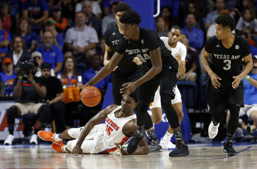 Feb 11, 2017; Gainesville, FL, USA; Florida Gators center John Egbunu (15) turns the ball over to Texas A&M Aggies forward Robert Williams (44) during the second half at Exactech Arena at the Stephen C. O'Connell Center. The Gators won 71-62. Mandatory Credit: Kim Klement-USA TODAY Sports