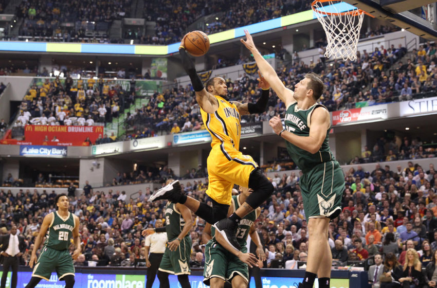 Feb 11, 2017; Indianapolis, IN, USA; Indiana Pacers guard Monta Ellis (11) dunks against Milwaukee Bucks forward Mirza Teletovic (35) at Bankers Life Fieldhouse. Milwaukee defeats Indiana 116-100. Mandatory Credit: Brian Spurlock-USA TODAY Sports