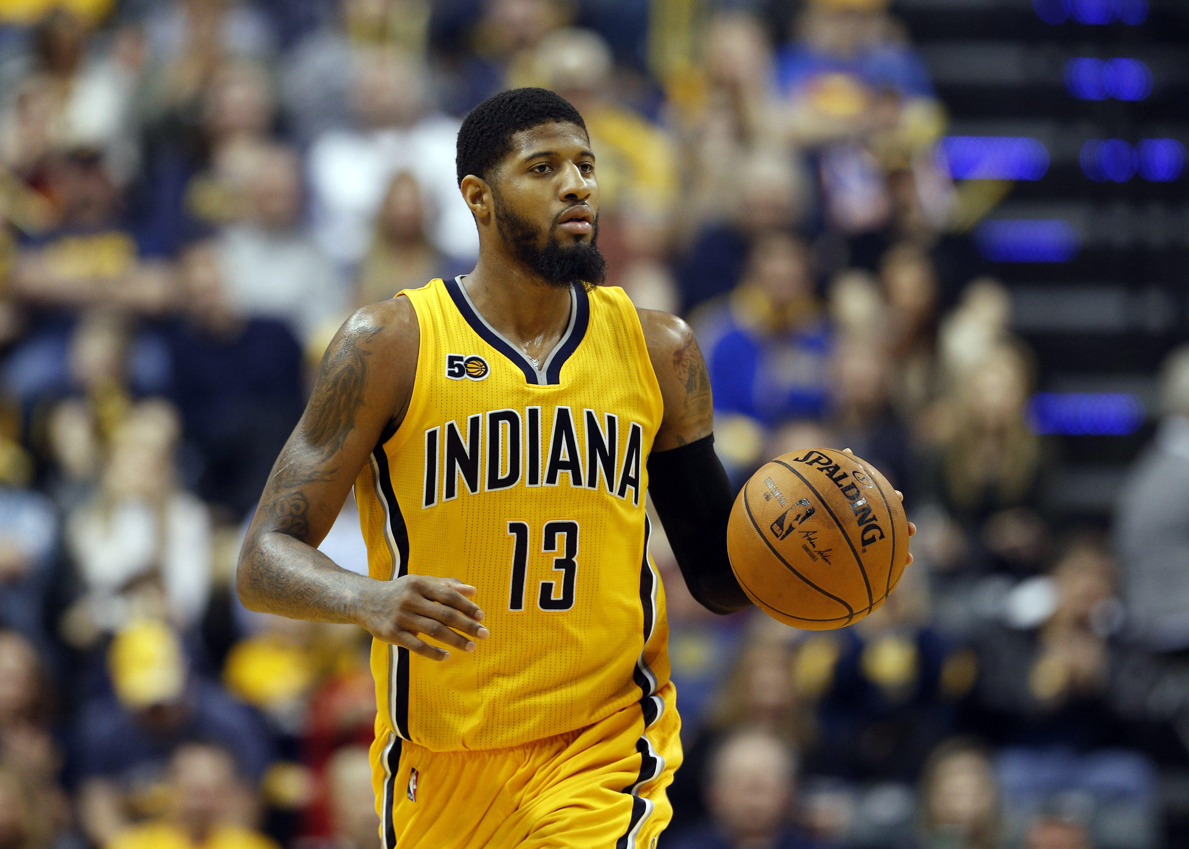 Feb 11, 2017; Indianapolis, IN, USA; Indiana Pacers forward Paul George (13) brings the ball up court against the Milwaukee Bucks at Bankers Life Fieldhouse. Milwaukee defeats Indiana 116-100. Mandatory Credit: Brian Spurlock-USA TODAY Sports
