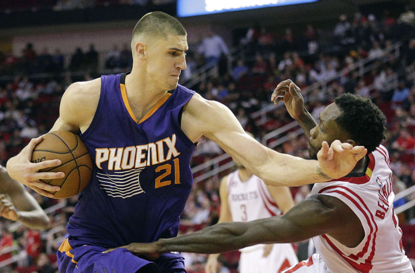 Feb 11, 2017; Houston, TX, USA; Phoenix Suns center Alex Len (21) fouls Houston Rockets guard Patrick Beverley (2) in the second half at Toyota Center. Houston Rockets won 133 to 102 .Mandatory Credit: Thomas B. Shea-USA TODAY Sports